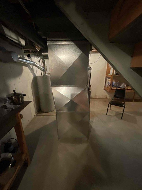 Conducted HVAC equipment replacement estimate for furnace and air conditioning system in basement location. Customer reported system not reaching set temperature. Reviewed existing equipment installation, including main trunk ductwork and air distribution system. Assessed current galvanized metal ductwork configuration and HVAC infrastructure to determine replacement requirements. Provided comprehensive estimate for complete furnace and A/C system replacement to address heating and cooling deficiencies.