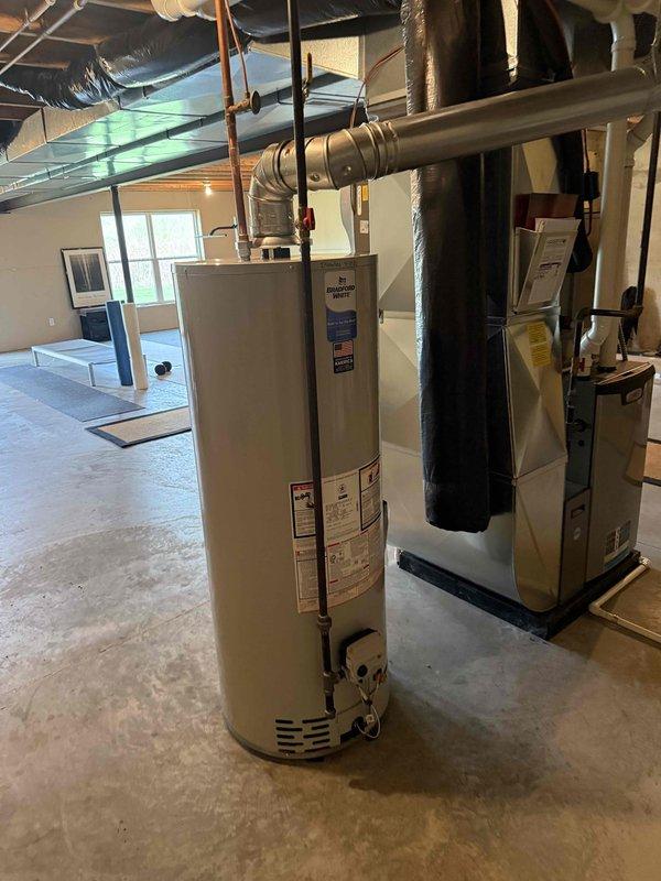 Installed a new 50-gallon tanked water heater in the basement utility area, replacing the existing unit. Connected all copper supply and discharge piping, installed pressure relief valve with proper discharge piping, and mounted expansion tank above the unit. Verified all connections for proper operation, established exhaust venting to code specifications, and tested the system to ensure adequate hot water delivery and safety compliance.