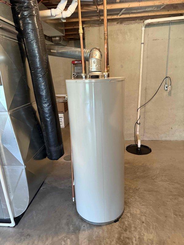 Installed a new 50-gallon tanked water heater in the basement utility area, replacing the existing unit. Connected all copper supply and discharge piping, installed pressure relief valve with proper discharge piping, and mounted expansion tank above the unit. Verified all connections for proper operation, established exhaust venting to code specifications, and tested the system to ensure adequate hot water delivery and safety compliance.