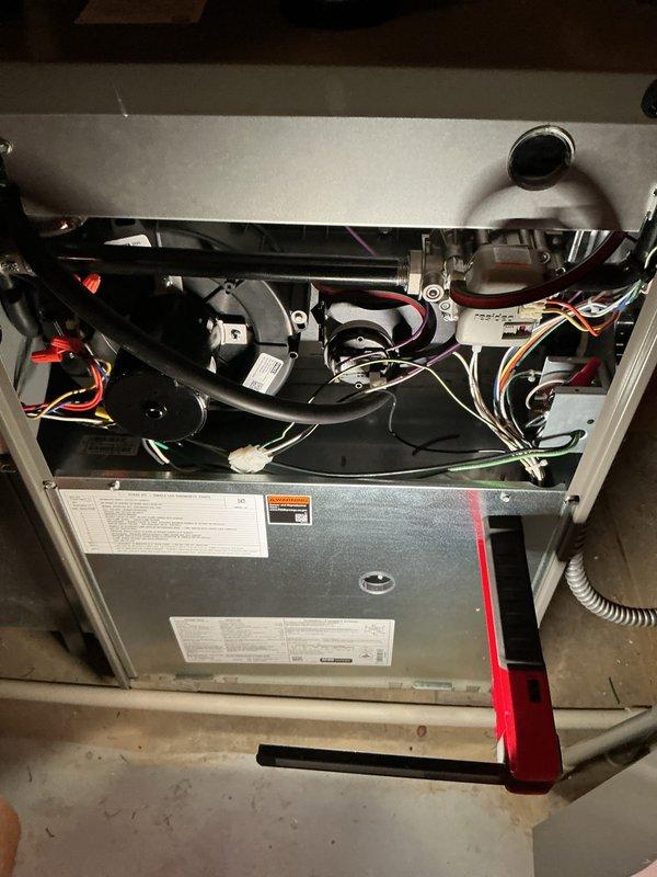 Completed comprehensive ComfortGuard maintenance package on residential HVAC system including interior furnace inspection and exterior condenser unit servicing. Interior work involved accessing furnace cabinet, inspecting blower motor assembly, electrical connections, and all internal mechanical components for proper operation and wear. Exterior maintenance included thorough inspection of dual condenser units, verifying fan operation, checking refrigerant levels, cleaning coils, and ensuring proper airflow through louvers. All components found to be in good working condition with no immediate repairs required; system operating within manufacturer specifications.