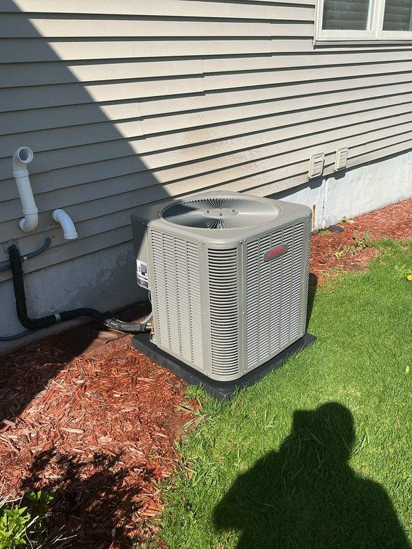 Completed annual cooling maintenance on residential outdoor condensing unit. Performed comprehensive system inspection including cleaning of condenser coils, verification of refrigerant levels, electrical connections testing, and operational assessment of all components. Unit found in good working condition with proper airflow through ventilation grilles, functioning fan motor, and secure mounting on vibration dampening pad with adequate clearances maintained for optimal performance.
