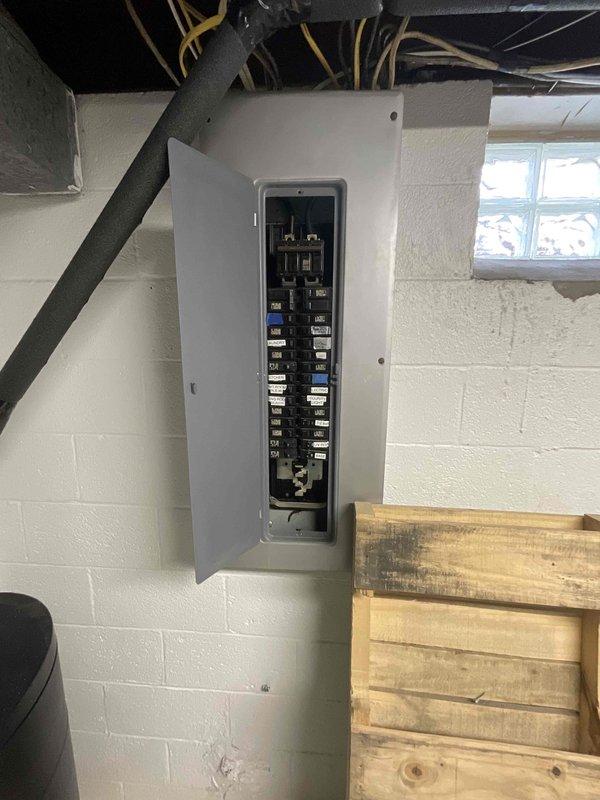Conducted on-site evaluation for central air conditioning system installation at property currently without existing AC infrastructure. Assessed electrical panel capacity and existing circuit breaker configuration to determine compatibility for new AC unit installation, documenting current electrical service capabilities and available breaker spaces for future equipment connection. Provided comprehensive estimate for complete AC system installation including equipment specifications and electrical requirements necessary to establish functional cooling system.