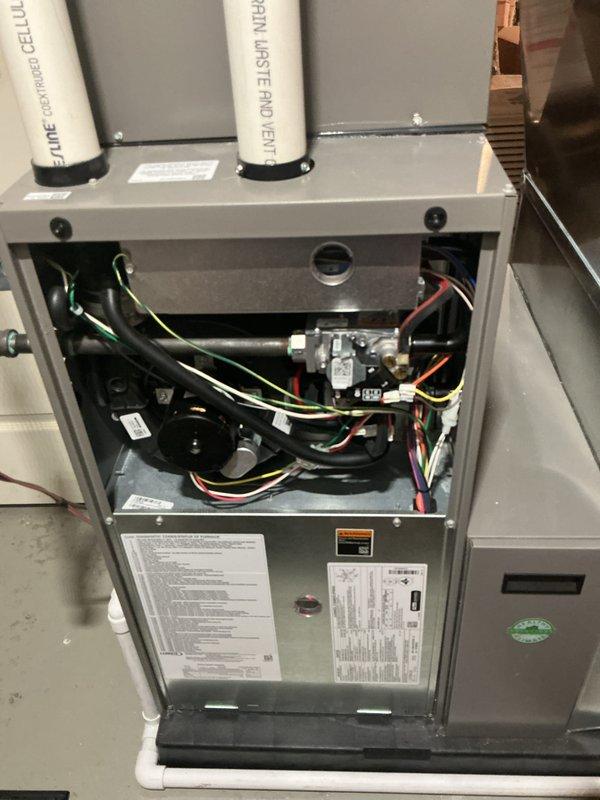 Completed annual heating maintenance on residential furnace system. Performed comprehensive inspection of all internal components including gas valve assembly, blower motor, control board, and electrical connections. Verified proper operation of condensate drainage system with PVC waste lines, checked all wire harnesses and connections for security and signs of wear, and confirmed control board functionality. All components found operating within normal parameters with no issues identified.