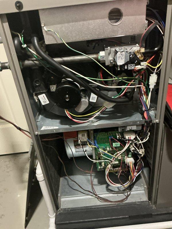 Completed annual heating maintenance on residential furnace system. Performed comprehensive inspection of all internal components including gas valve assembly, blower motor, control board, and electrical connections. Verified proper operation of condensate drainage system with PVC waste lines, checked all wire harnesses and connections for security and signs of wear, and confirmed control board functionality. All components found operating within normal parameters with no issues identified.
