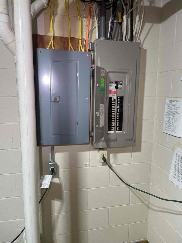 Completed on-site assessment for whole-home standby generator installation at a 33-year-old residential property. Evaluated existing electrical infrastructure, including main service panels and circuit breaker configuration, to determine generator sizing requirements and transfer switch placement options. Photographed electrical panels, plumbing systems, and utility areas to assess clearance requirements and optimal generator pad location for either Kohler or Generac unit installation. Documented current electrical service capacity and identified necessary electrical connections for automatic transfer switch integration with existing panel configuration.