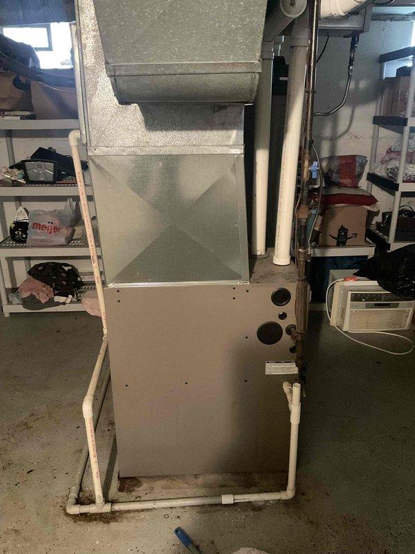 Conducted on-site evaluation of 20+ year old HVAC system in basement that was not cooling properly. Assessed existing York furnace and air conditioning equipment, documented current installation including ductwork configuration, condensate drainage system, and electrical connections. Provided comprehensive replacement estimate for complete system upgrade to address inadequate cooling performance and aging equipment.