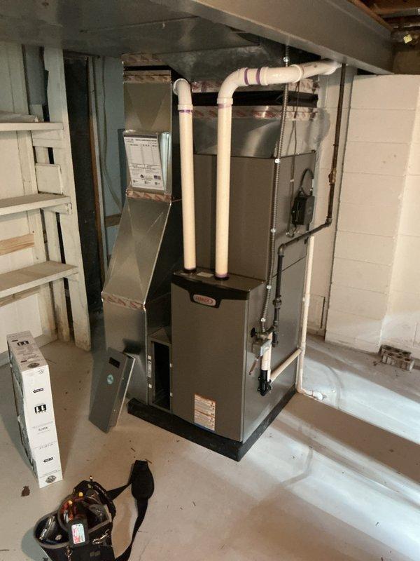 Completed annual HVAC maintenance on Lennox furnace system in basement utility area. Performed standard ACM procedures including filter inspection and replacement, verified proper operation of heating unit, checked PVC intake and exhaust venting for proper function, and inspected ductwork connections. All components operating within normal parameters upon completion of maintenance visit.