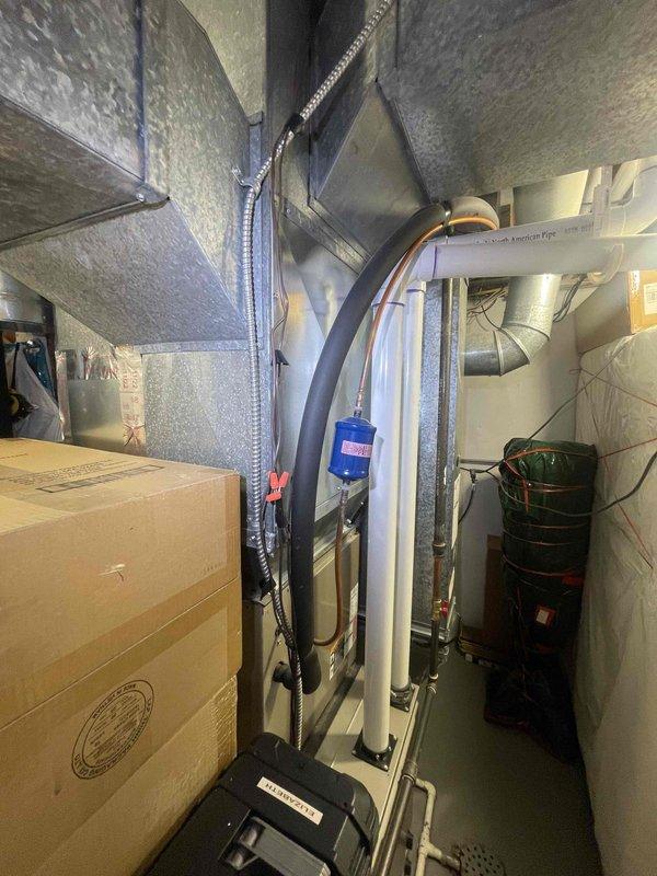 Conducted indoor air quality consultation for 2001 HVAC system to evaluate feasibility of adding UV light and ionization devices. Inspected mechanical room equipment configuration, documented existing ductwork layout and clearances, and assessed available installation space for air purification upgrades. Provided recommendations for compatible IAQ enhancement options based on current system specifications and spatial constraints.