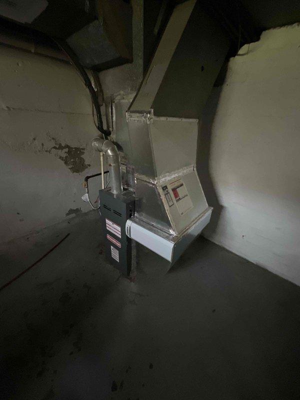 Conducted comprehensive assessment of existing HVAC system for replacement estimate, evaluating a 31-year-old air conditioning unit and 20-year-old furnace system located in basement utility area. Documented current equipment conditions through detailed photography, noting age-related deterioration and wear patterns on both heating and cooling components. Provided pricing options for both combined system replacement and separate unit replacement to allow comparison of installation approaches based on equipment lifecycle and operational efficiency considerations.