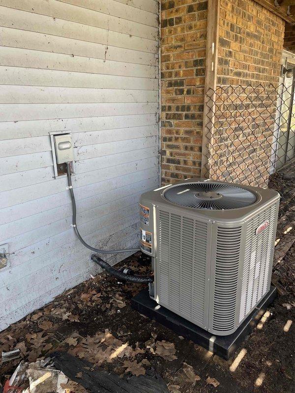 Successfully installed a complete 2.5-ton air conditioning system with matching evaporator coil at the rear of the property. The outdoor condenser unit was positioned on a stable pad against the building exterior with proper electrical disconnect and conduit routing, while the indoor coil was installed in the existing structure with appropriate refrigerant line connections and drainage piping. All mechanical and electrical connections were completed per code requirements, the system was charged, tested, and verified operational.