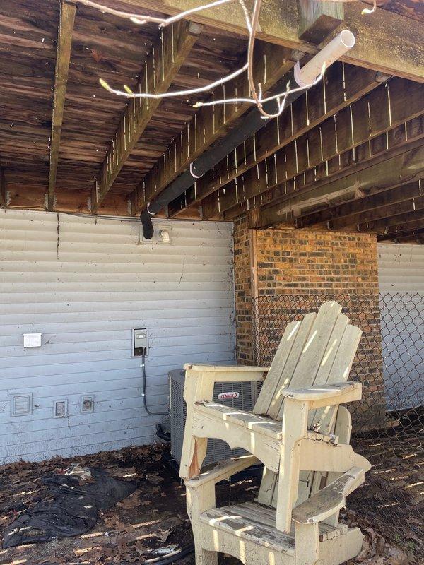 Successfully installed a complete 2.5-ton air conditioning system with matching evaporator coil at the rear of the property. The outdoor condenser unit was positioned on a stable pad against the building exterior with proper electrical disconnect and conduit routing, while the indoor coil was installed in the existing structure with appropriate refrigerant line connections and drainage piping. All mechanical and electrical connections were completed per code requirements, the system was charged, tested, and verified operational.