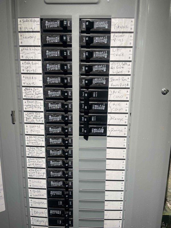 Conducted comprehensive site assessment for new Kohler whole home generator installation. Evaluated existing electrical service panel containing dual-column breaker configuration with circuits serving residential loads including HVAC systems, major appliances, and general lighting circuits. Documented panel capacity and circuit distribution to determine proper generator sizing and transfer switch requirements. Inspected basement utility area and identified suitable location for generator pad placement with consideration for drainage systems, existing sump pump installation, and PVC discharge piping. Assessed electrical service entrance and determined optimal routing for generator feeder cables and automatic transfer switch integration with existing distribution panel.