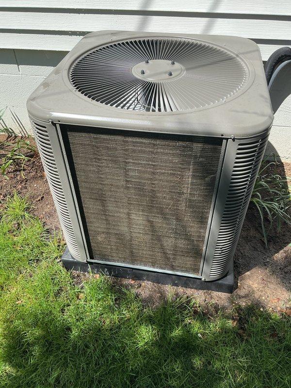 Completed scheduled Air Care Cooling maintenance on outdoor HVAC system. Replaced heavily soiled and discolored air filter showing significant dust and debris accumulation. Inspected condenser unit exterior, confirmed proper fan grille condition, and verified unit positioning on concrete pad remains stable.