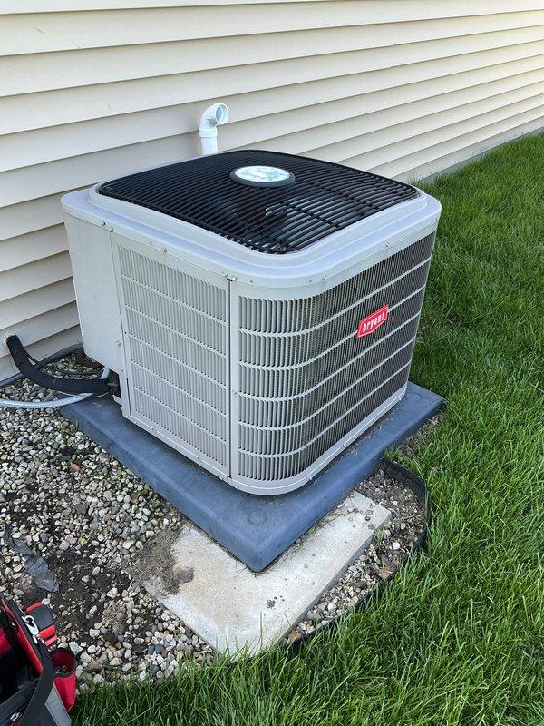 Performed annual preventative maintenance on Bryant residential air conditioning system. Inspected outdoor condenser unit, finding equipment in good operating condition with clean coil fins and proper clearances. Replaced air filter and checked system operation. Unit tested successfully with no issues identified. System ready for cooling season.