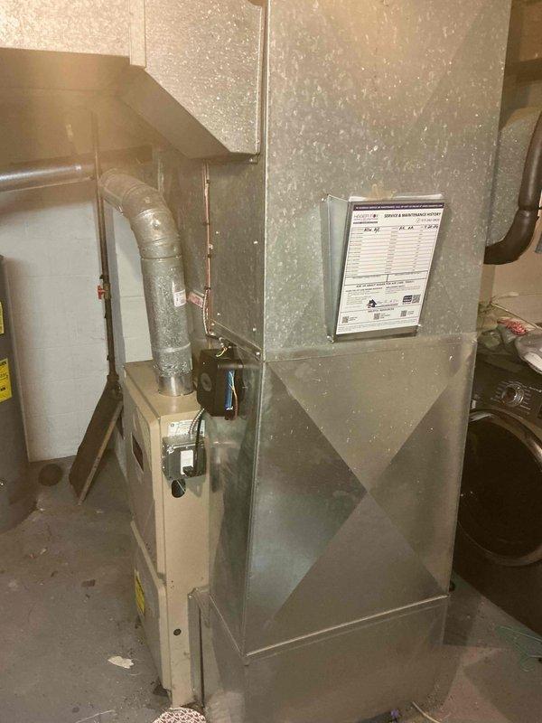 Completed full installation of 2.5-ton air conditioning system with matching evaporator coil. Installed outdoor condensing unit on pad against exterior wall with proper clearances, connected refrigerant lines, and mounted indoor coil to existing air handler in basement. System was evacuated, charged to manufacturer specifications, tested for proper operation, and all electrical connections were verified. Mechanical permit obtained prior to installation.