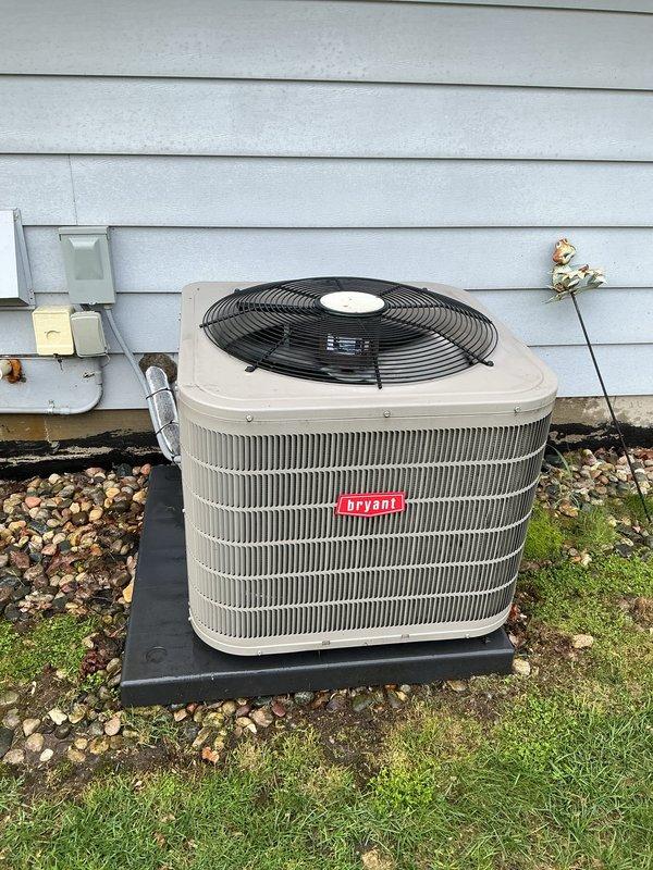 Completed scheduled air conditioning maintenance on Bryant residential condenser unit. Delivered replacement air filter as requested per urgency list, with service appointment rescheduled to earlier date to accommodate customer needs. Documented equipment condition with photographs showing unit in operational status on concrete pad with proper clearances maintained.