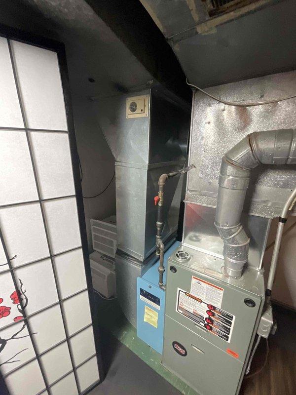 Conducted site assessment for central air conditioning system installation at residence with no existing AC. Evaluated basement mechanical room containing furnace and water heater, inspected existing ductwork infrastructure, and determined optimal equipment placement and distribution routing. Provided comprehensive estimate for complete central air system installation including outdoor condensing unit, evaporator coil integration with existing forced-air furnace, refrigerant lines, electrical connections, thermostat upgrade, and any necessary ductwork modifications to accommodate cooling distribution.