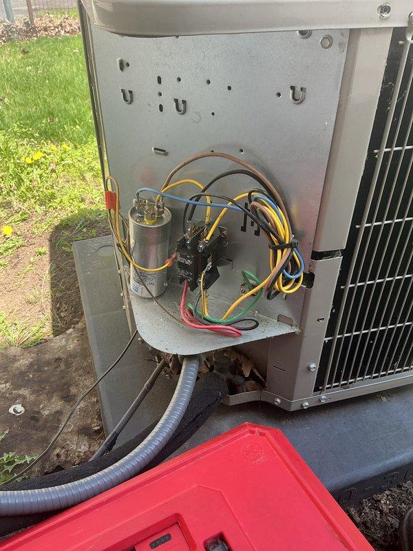 Completed annual HVAC maintenance on residential outdoor condensing unit. Inspected electrical compartment including capacitor, contactor, and all wire connections; verified proper operation of all components. Reviewed manufacturer specifications and safety labels; confirmed unit compliance with refrigerant regulations and proper system documentation.