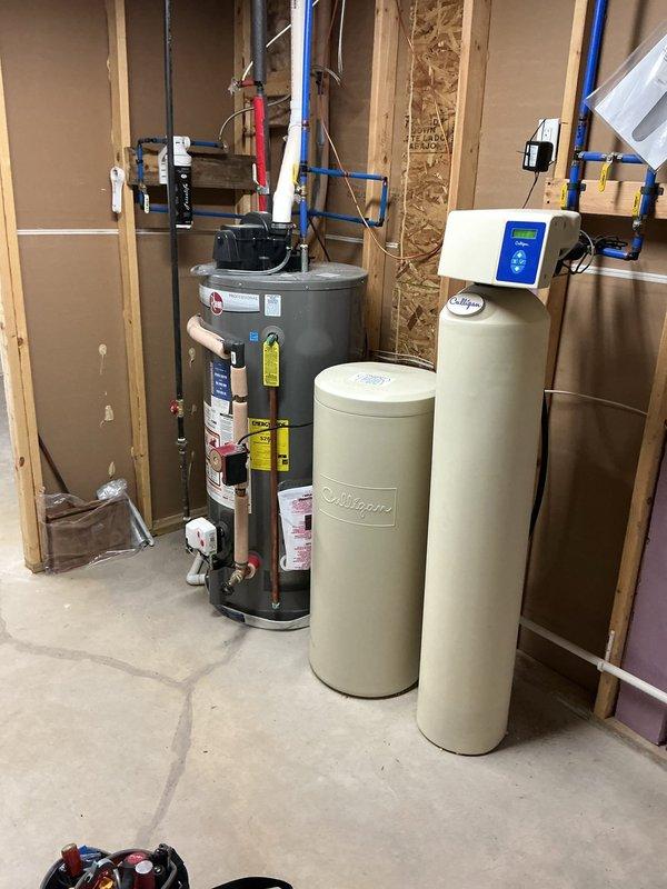 Responded to no-heat call on forced air furnace system. Upon arrival, performed diagnostic inspection of unit located in unfinished mechanical room. Visual inspection revealed blue burner assemblies and internal blower components in good physical condition. Tested electrical connections and control board wiring harness, noting proper wire terminations at white connector housing. Examined blower motor assembly and capacitor for signs of failure. Checked gas valve operation and ignition sequence. Cycled unit through startup sequence to identify failure point. System components showed no visible signs of age-related deterioration or mechanical failure. Documented internal components and mechanical room setup with diagnostic photographs. Completed walkthrough inspection with homeowner regarding findings and operational status.