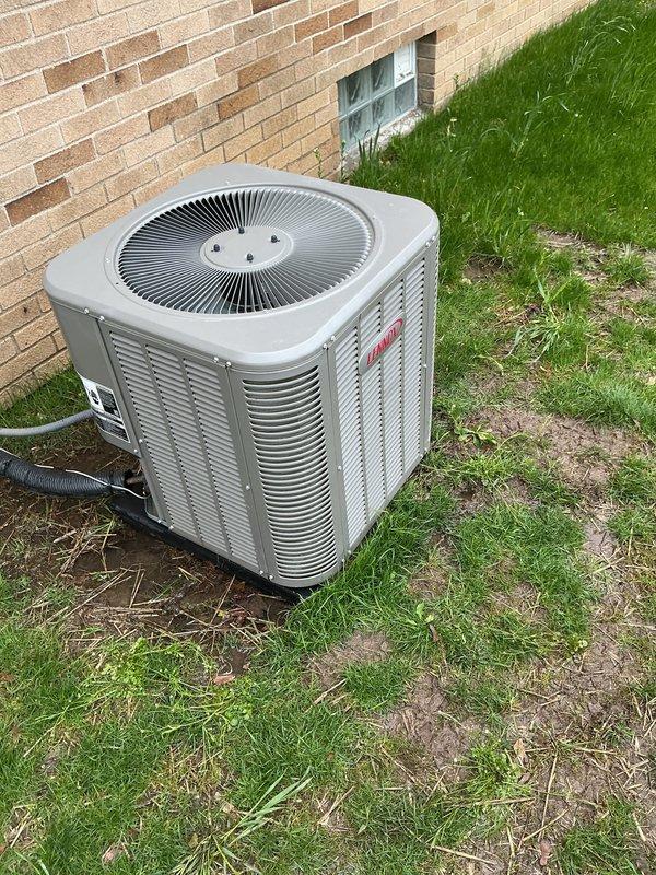 Completed annual air conditioning maintenance on residential outdoor condenser unit. Inspected cylindrical condenser coil fins and circular fan assembly, confirmed proper operation of all mechanical components. Replaced HVAC air filter and addressed high-flow spots as needed to ensure optimal system airflow and efficiency.