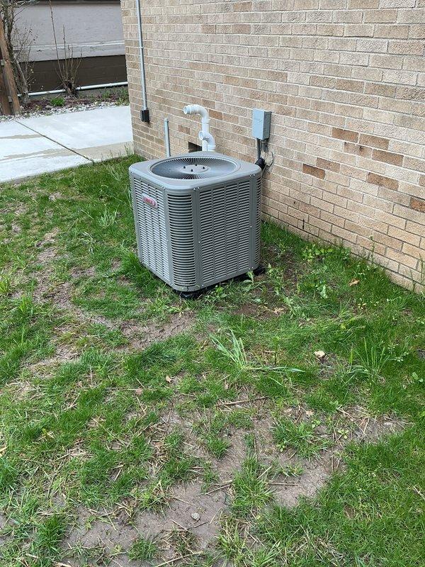 Completed annual air conditioning maintenance on residential outdoor condenser unit. Inspected cylindrical condenser coil fins and circular fan assembly, confirmed proper operation of all mechanical components. Replaced HVAC air filter and addressed high-flow spots as needed to ensure optimal system airflow and efficiency.