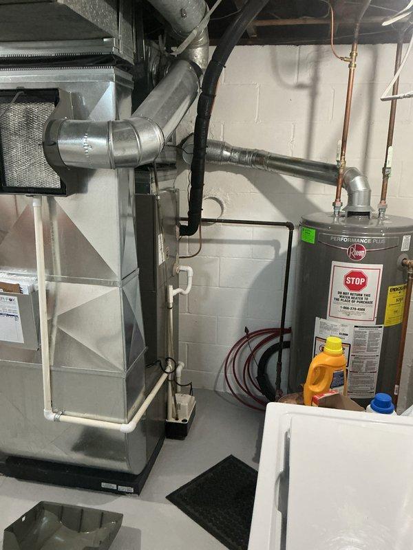 Completed annual cooling maintenance on residential HVAC system. Inspected air handler unit, verified clean air filter with proper airflow, examined blower assembly and ductwork connections for proper operation. All components found in good working condition with no deficiencies noted.