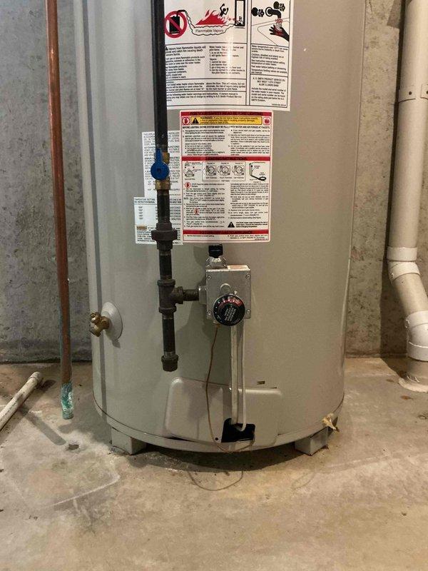 Performed diagnostic evaluation of 17-year-old furnace and 24-year-old tank-style water heater for new homeowners concerned about operating costs and hot water capacity. Inspected furnace operation, combustion efficiency, and ductwork connections; unit functioning within normal parameters but showing age-related wear. Evaluated water heater performance, noting original 2002 installation with visible aging of components, controls, and plumbing connections. Documented equipment conditions with photographs and provided recommendations for system optimization and future replacement planning given the advanced age of both units.