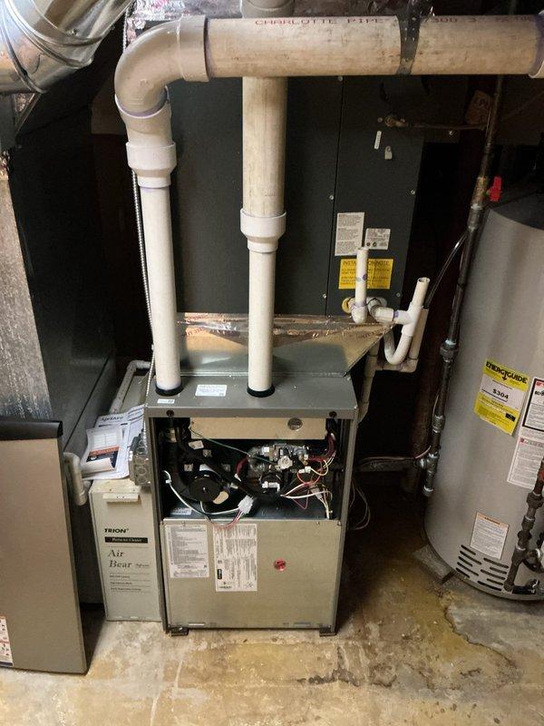 Completed annual cooling maintenance on residential Goodman central air conditioning system, model CAPF048D2C utilizing R22 refrigerant. Performed comprehensive inspection of furnace and air handler components in basement mechanical room, verified proper operation of gas valves, electrical connections, and safety controls. Documented equipment condition through photographic records showing unit specifications, pressure ratings, and installation compliance with manufacturer guidelines.