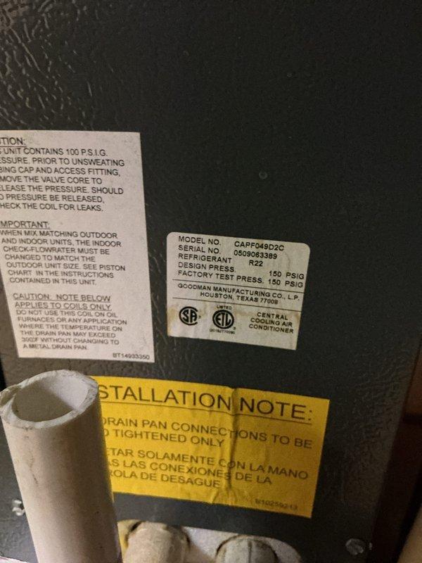 Completed annual cooling maintenance on residential Goodman central air conditioning system, model CAPF048D2C utilizing R22 refrigerant. Performed comprehensive inspection of furnace and air handler components in basement mechanical room, verified proper operation of gas valves, electrical connections, and safety controls. Documented equipment condition through photographic records showing unit specifications, pressure ratings, and installation compliance with manufacturer guidelines.