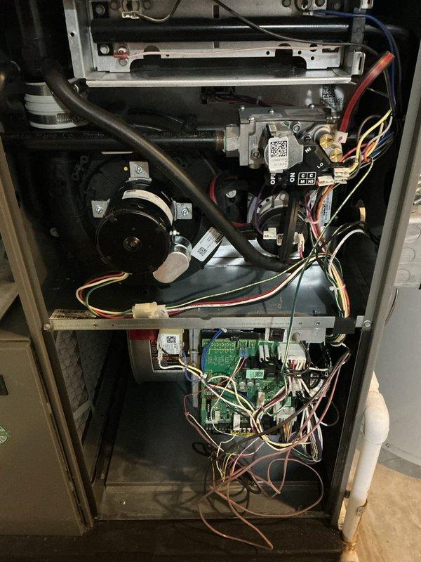 Completed scheduled ComfortGuard maintenance visit on residential HVAC system. Replaced furnace filter and humidifier pad as requested. Performed comprehensive inspection of furnace unit including heat exchanger, blower motor assembly, gas valve connections, control board, and all electrical connections. All components found in proper working condition with secure mounting and intact wiring throughout system.