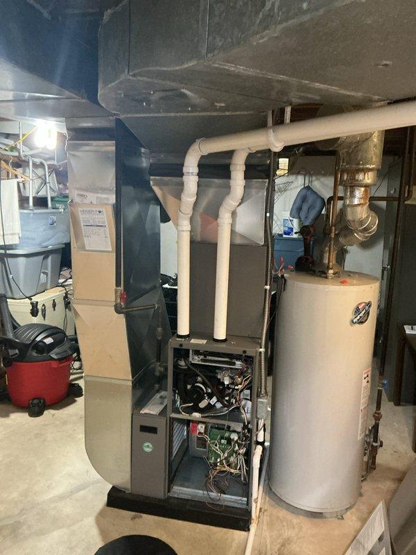 Completed scheduled ComfortGuard maintenance visit on residential HVAC system. Replaced furnace filter and humidifier pad as requested. Performed comprehensive inspection of furnace unit including heat exchanger, blower motor assembly, gas valve connections, control board, and all electrical connections. All components found in proper working condition with secure mounting and intact wiring throughout system.