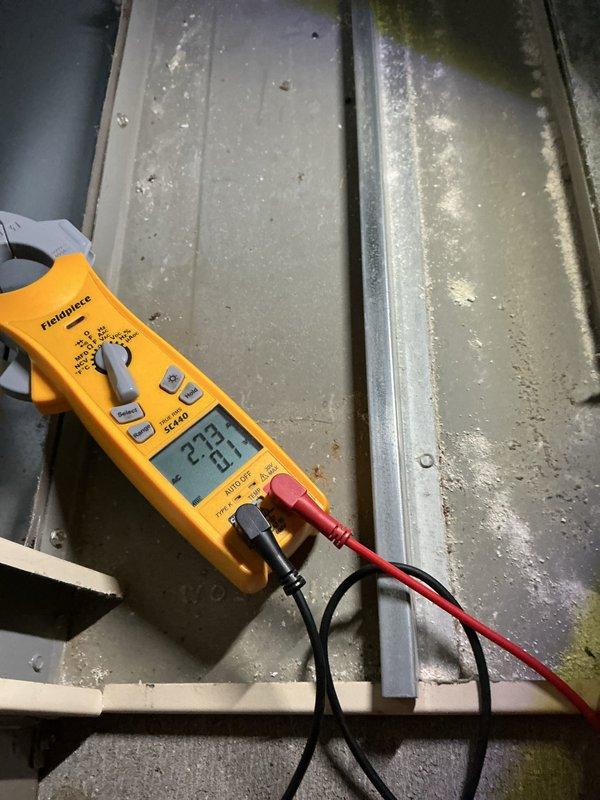 Completed annual preventative maintenance on residential split system air conditioning unit. Performed comprehensive system diagnostics including electrical testing with multimeter showing proper voltage readings, installed pressure gauges to verify refrigerant charge levels, and inspected outdoor condenser unit. Cleaned condenser coil fins, removed debris accumulation around unit base, and confirmed all mechanical and electrical components operating within manufacturer specifications.