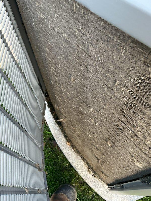 Completed spring AC tune-up on Lennox system with 2-year warranty coverage remaining through April 2028. Performed comprehensive maintenance inspection of indoor air handler unit in basement, verifying proper operation of furnace components, condensate drainage system, and refrigerant lines. Inspected outdoor condenser unit and documented significant accumulation of dirt and debris on mesh panel and coil surfaces requiring attention. System currently operating properly with all components functioning as designed.