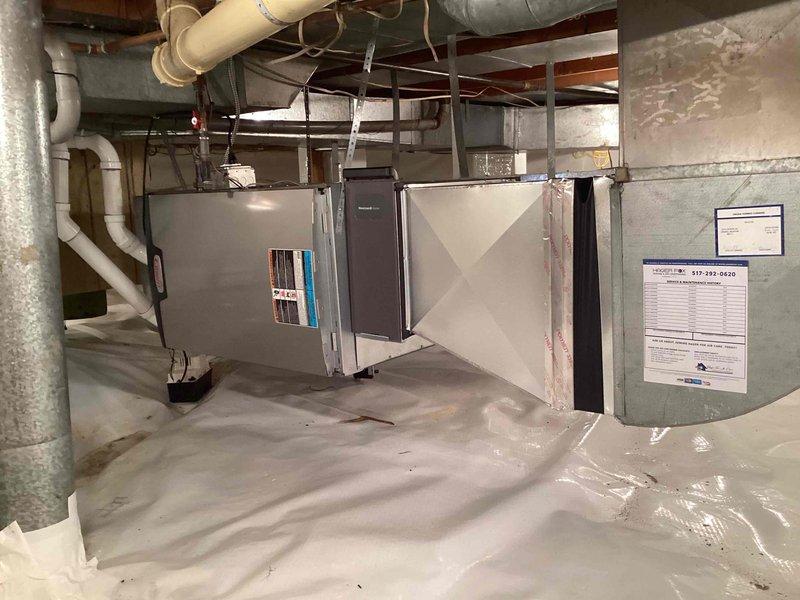 Completed installation of 90,000 BTU high-efficiency furnace in basement crawl space area. Installed new air handler unit with integrated filtration system, connected all necessary ductwork with proper reinforcement and support hangers, and established vapor barrier flooring protection. Reconnected all electrical and gas connections per code requirements, verified proper venting through existing PVC exhaust system, and ensured all mechanical components were securely mounted and operational.