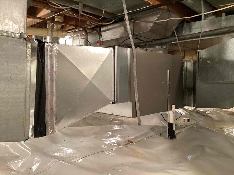 Completed installation of 90,000 BTU high-efficiency furnace in basement crawl space area. Installed new air handler unit with integrated filtration system, connected all necessary ductwork with proper reinforcement and support hangers, and established vapor barrier flooring protection. Reconnected all electrical and gas connections per code requirements, verified proper venting through existing PVC exhaust system, and ensured all mechanical components were securely mounted and operational.