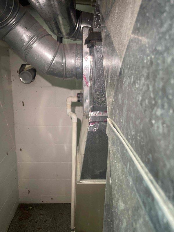 Conducted on-site evaluation for heat pump system replacement on 1,450 square foot residential property. Assessed existing 16-year-old central air conditioning unit and ductwork configuration in basement mechanical room to determine compatibility with proposed heat pump installation while retaining existing gas furnace for supplemental heating. Inspected galvanized metal ductwork system, air handler mounting, and insulated supply lines to verify structural integrity and capacity for hybrid heating system integration. Documented current HVAC infrastructure including sheet metal plenum connections, mechanical fasteners, and foil-faced insulation material. Evaluated electrical service capacity and refrigerant line routing requirements for heat pump conversion. Provided technical specifications and equipment recommendations for dual-fuel system configuration to meet customer timeline for installation within one month.