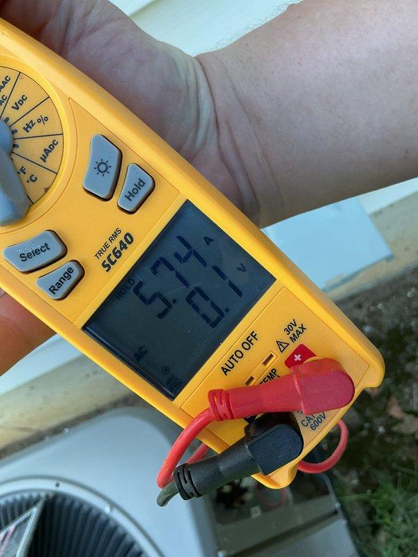 Completed annual Air Care Cooling maintenance service on office air conditioning unit. Performed comprehensive system diagnostics using digital multimeter, measuring temperature differentials across the condenser coil with readings of 54.4°F and 53.7°F, and recorded capacitance reading of 38.15 MFD to verify compressor capacitor performance within manufacturer specifications. All electrical components tested and found operating normally, ensuring continued reliable system operation for the upcoming cooling season.