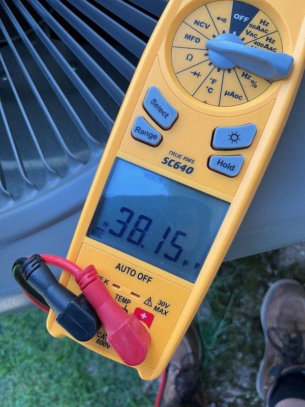 Completed annual Air Care Cooling maintenance service on office air conditioning unit. Performed comprehensive system diagnostics using digital multimeter, measuring temperature differentials across the condenser coil with readings of 54.4°F and 53.7°F, and recorded capacitance reading of 38.15 MFD to verify compressor capacitor performance within manufacturer specifications. All electrical components tested and found operating normally, ensuring continued reliable system operation for the upcoming cooling season.