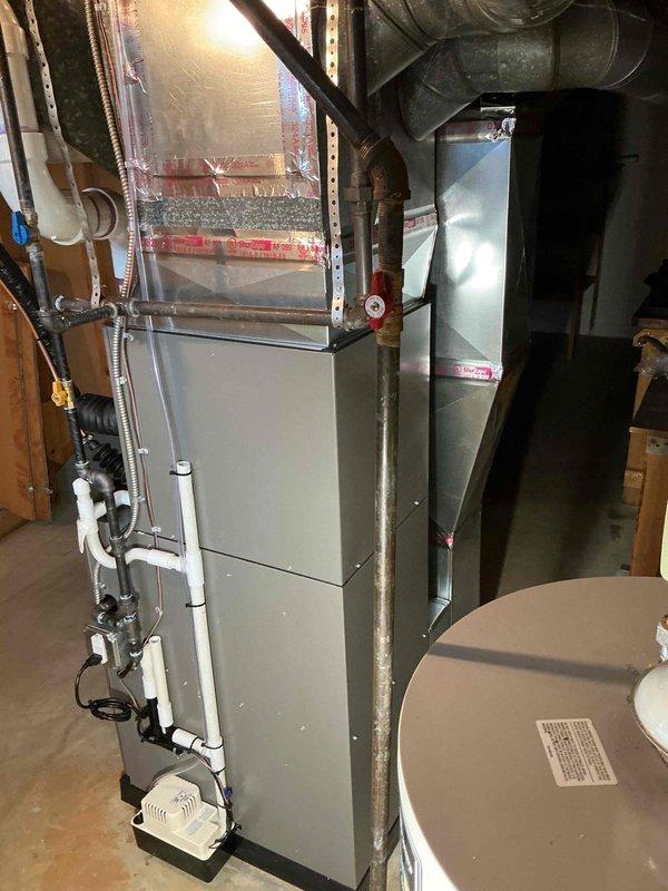 Completed full HVAC system installation including a 70,000 BTU furnace and 2-ton air conditioning unit with rear discharge configuration. Installed new PVC venting system with proper routing and termination, connected condensate drainage lines, and integrated metallic flex ductwork to existing distribution system. Reconnected all electrical components, verified proper airflow, and ensured system operation meets manufacturer specifications and local code requirements.