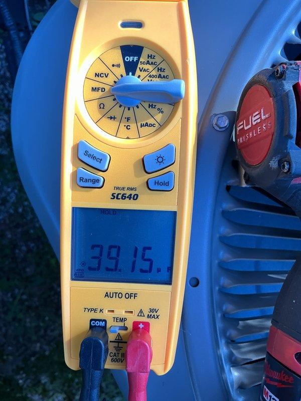 Completed annual cooling maintenance on residential air conditioning system. Performed comprehensive inspection of outdoor condenser unit, tested capacitor readings with multimeter showing 39.15 MFD, and replaced air filter and evaporator pad as needed. Unit operating within normal parameters with no deficiencies noted.