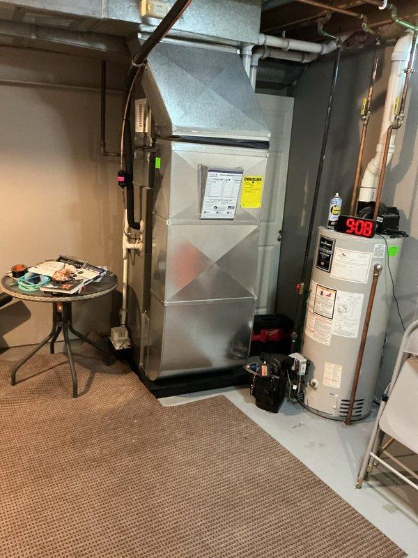 Completed routine Air Care Heating and Cooling maintenance on Lennox furnace system. Inspected all major components including heat exchanger, blower assembly, and venting system with white PVC exhaust pipes. Verified proper operation of furnace controls, checked LED indicator functionality, and examined all electrical connections. Inspected associated ductwork, copper refrigerant lines with insulation, and confirmed proper mounting and support. System tested and operating within normal parameters upon completion of preventative maintenance service.