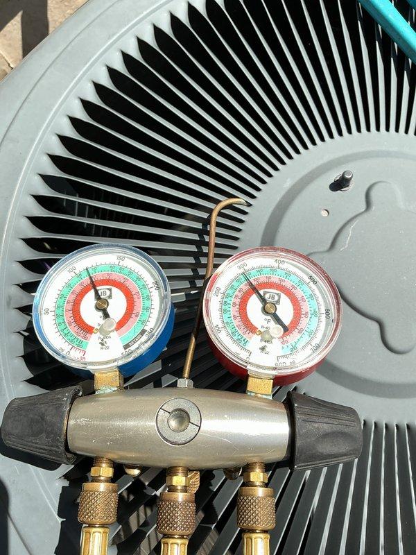 Completed scheduled preventive maintenance on residential air conditioning system. Performed comprehensive inspection of outdoor condenser unit, checked refrigerant pressures using manifold gauge set with readings within manufacturer specifications, verified proper operation of condenser fan, and documented equipment condition through photographs for service records.