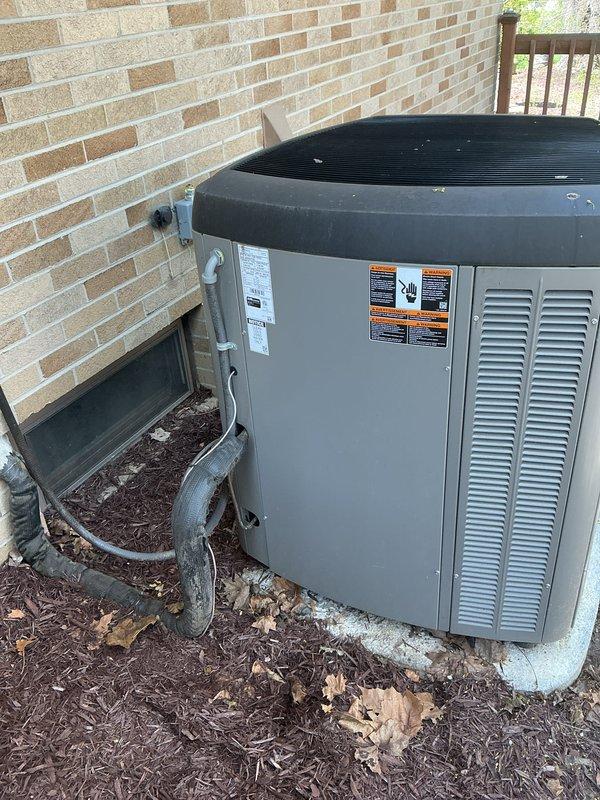 Completed annual cooling maintenance on residential HVAC system. Inspected indoor evaporator coil assembly showing frost accumulation on A-frame coil configuration, checked refrigerant lines and connections, verified condensate drain line operation, and examined outdoor condensing unit. Replaced air filters as part of routine preventive maintenance to ensure optimal system performance for the cooling season.