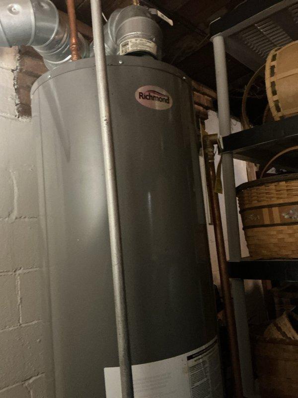 Responded to no water call with reported basement flooding and water heater pilot light failure. Upon inspection, assessed Richmond brand water heater unit and associated plumbing connections including copper supply lines, PVC venting, pressure relief valve assembly, and expansion tank. Evaluated system for water damage and determined repairability of existing equipment versus replacement options.