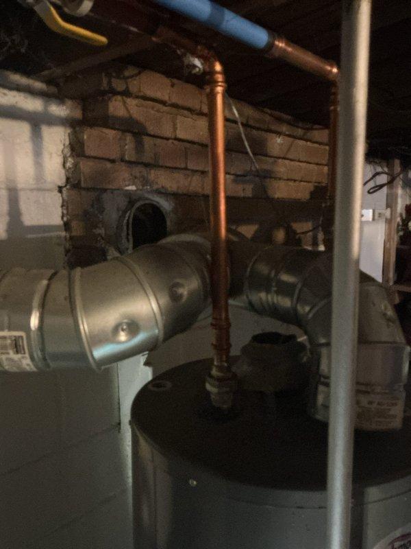 Responded to no water call with reported basement flooding and water heater pilot light failure. Upon inspection, assessed Richmond brand water heater unit and associated plumbing connections including copper supply lines, PVC venting, pressure relief valve assembly, and expansion tank. Evaluated system for water damage and determined repairability of existing equipment versus replacement options.
