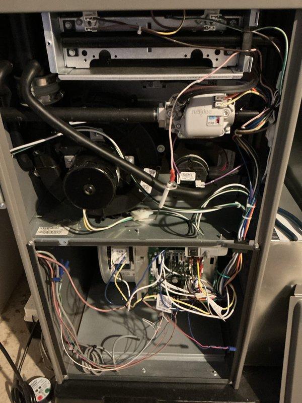 Completed comprehensive Air Care Heating and Cooling maintenance on residential HVAC system. Performed thorough inspection of furnace interior components including blower motor assembly, gas valve, control board, and electrical wiring connections; verified proper operation of evaporator coil and condensate drain system with PVC piping. All components inspected, system operating within normal parameters, and photographic documentation captured for service records.