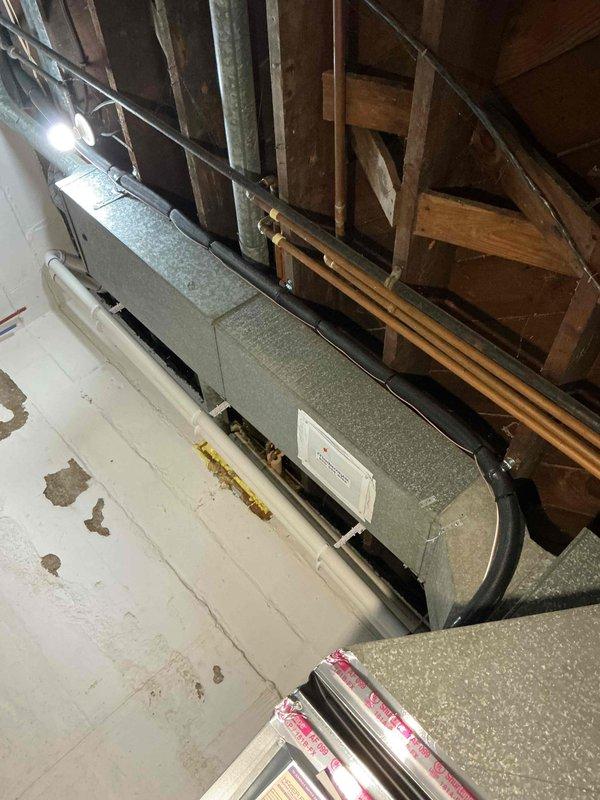 Completed full HVAC system installation including a 70,000 BTU furnace and 2.5-ton air conditioning unit in attic space with left-side configuration. Installed new air handler with flexible ductwork connections, reconnected existing electrical service, and mounted Sensi programmable digital thermostat on interior wall. System commissioned and tested for proper operation with all mechanical permits obtained prior to installation.