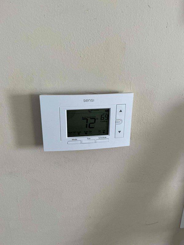 Completed full HVAC system installation including a 70,000 BTU furnace and 2.5-ton air conditioning unit in attic space with left-side configuration. Installed new air handler with flexible ductwork connections, reconnected existing electrical service, and mounted Sensi programmable digital thermostat on interior wall. System commissioned and tested for proper operation with all mechanical permits obtained prior to installation.