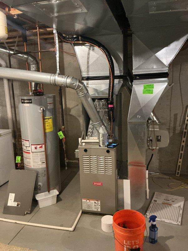 Completed annual cooling maintenance on residential HVAC system. Performed comprehensive inspection of Bryant furnace and associated components, verified proper operation of water heater connections and safety controls, checked all ductwork connections and plenum assemblies for secure fastening and proper airflow. All equipment found operating within normal parameters with no immediate service needs identified.