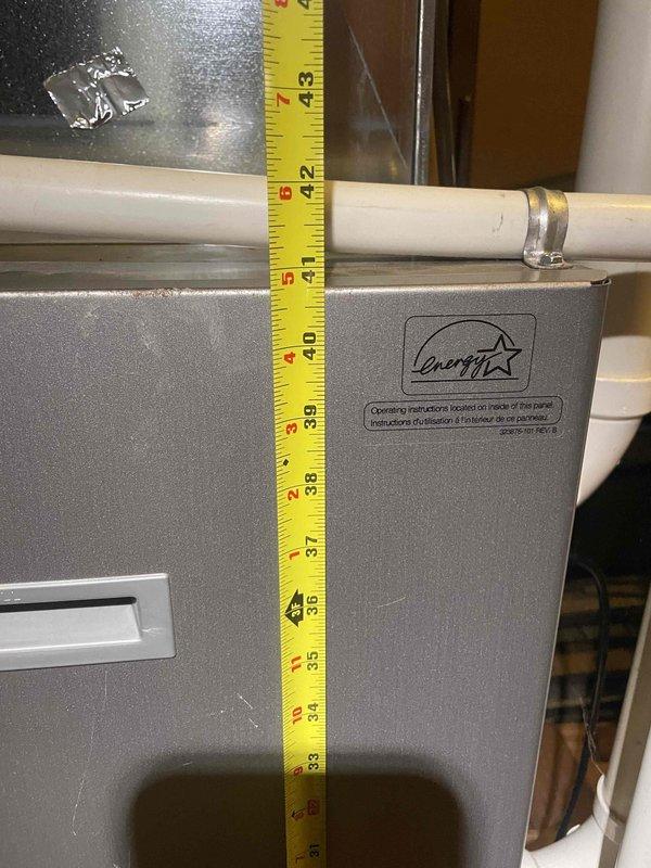 Conducted comprehensive assessment of existing furnace system for replacement estimate. Evaluated current Energy Star-rated equipment, documented equipment specifications and measurements, and assessed installation configuration including venting system with PVC piping. Inspected surrounding mechanical room infrastructure, including water heater and associated plumbing connections, to determine spatial requirements and potential installation considerations for new furnace unit. Photographed existing equipment condition and clearances to support accurate equipment sizing and replacement proposal.